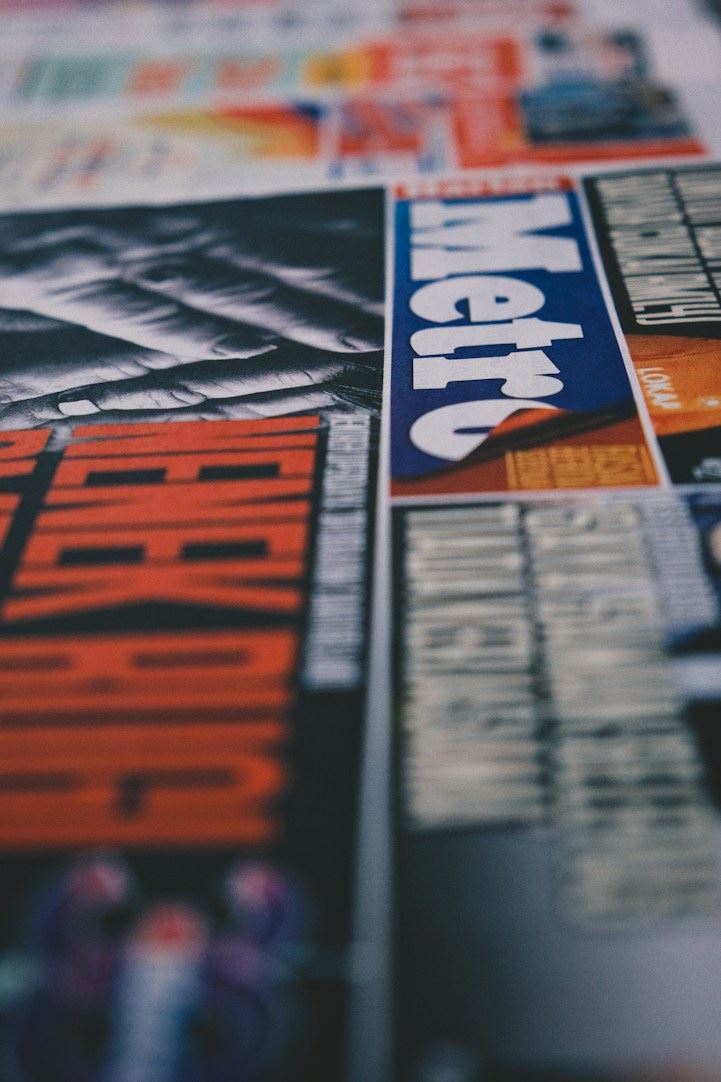 Stacked newspapers and magazine covers