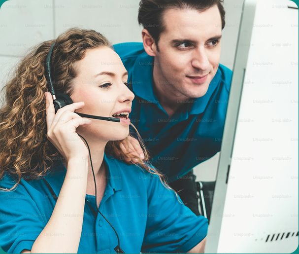 A support specialist with a headset helping a customer