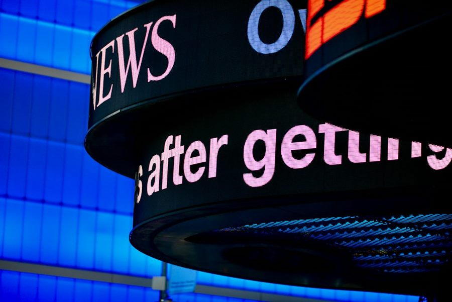 A curved digital news ticker display
