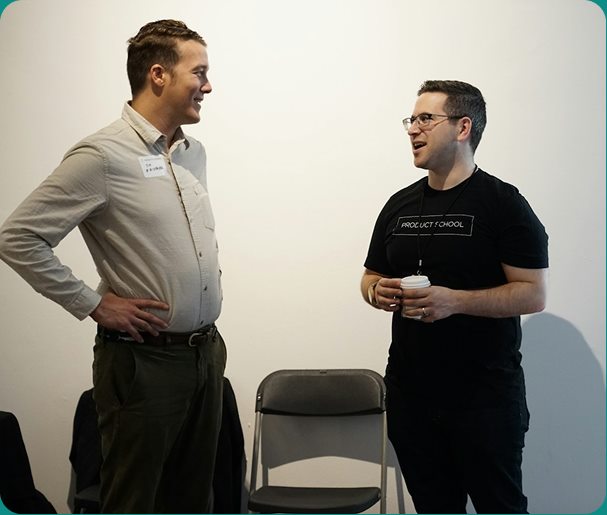 Two colleagues talking at a media event